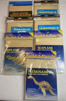 7 Wooden 3D Puzzles Build your own Dinosaurs Bi plane & more Star Paper Board - Image 1 of 4