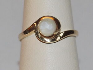 10K Yellow Gold Ring With A Solitaire Cultured Pearl Set In A Gold Wave Design 