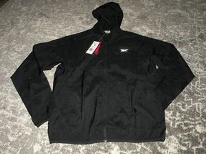 Chaqueta cortavientos Reebok para hombre con capucha cremallera frontal talla mediana nueva con etiquetas $60 venta al por menor - Imagen 1 de 2