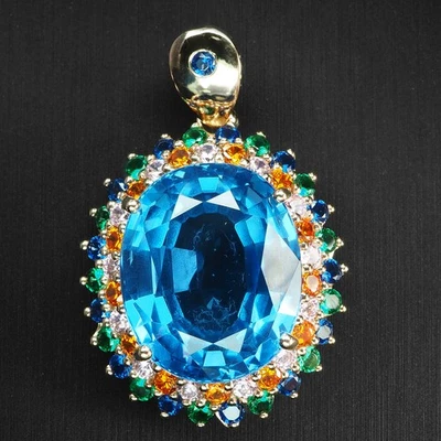 Encantadores colgantes de oro rosa de plata de ley 925 ovalados de topacio azul de Londres de 22,95 quilates Foto 1 de 4