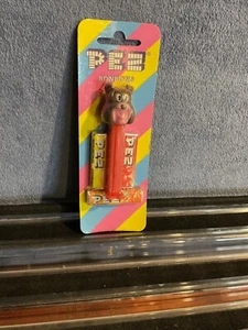 Pez MGM Spike with Pink Face, Mint on Striped Card - Picture 1 of 2