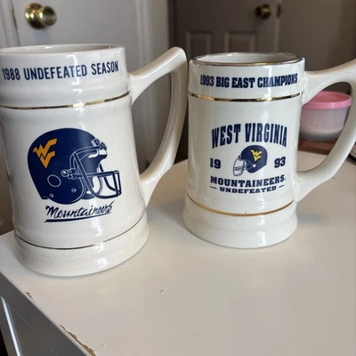 De colección West Virginia Mountaineers 1988 y 1993 temporada invicta Big East Steins Foto 1 de 4