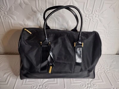 Bolso de viaje grande Estee Lauder negro con doble asa Foto 1 de 4