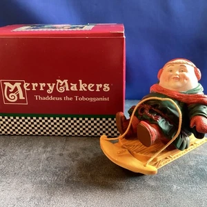 Merry Makers “Thaddeus the Tobogganist”  Dept 56 Christmas Figurine- Lot #MM104 - Picture 1 of 2