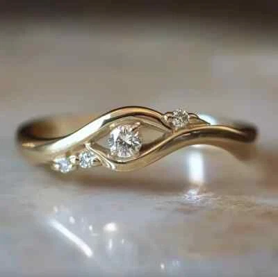 Anillo nupcial de derivación de oro amarillo de 10 quilates con diamantes cultivados en laboratorio de 0,14 quilates de corte redondo ojo de pájaro Foto 1 de 4