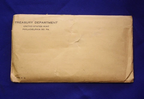 1957 U.S. PROOF SET.  The Coins are U.S. Mint Sealed in a flat cello Cover