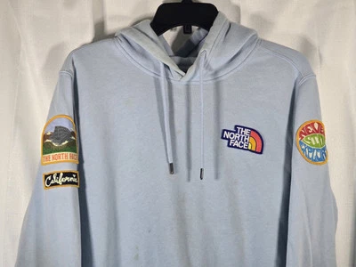 THE NORTH FACE Para Hombres Novedad Parche Pullover Sudadera con Capucha Azul Claro Suéter Talla Pequeña Foto 1 de 4