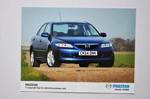 Foto de prensa de coche - Mazda 6 2004 - azul - vista frontal/lateral - Imagen 1 de 1