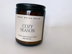 Sweet Water Decor Cozy Season Candle Woods, Warm Spice, and Citrus Autumn Scent - Picture 1 of 3