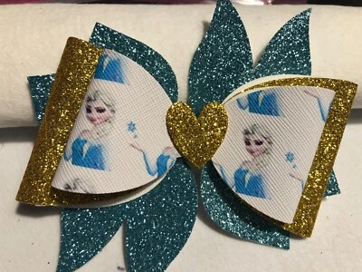 PINWHEEL FROZEN 3 LAYER HAIR BOW. BLUE, GOLD AND WHITE. 4"X4.5", HOMEMADE - Image 1 of 3