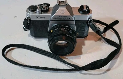 Cámara fotográfica Asahi Pentax K1000 35 mm SLR con lente SMC Pentax 50 mm f/2 Foto 1 de 4