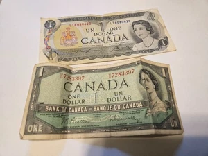 Lote de 2 billetes de un dólar del Banco de Canadá Ottawa 1973 y 1954 - Imagen 1 de 5