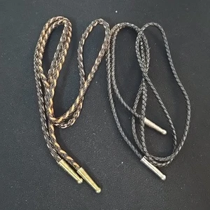 Set 2 cravatte bolo vintage in pelle con punte marrone e nero argento e oro lotto 2 - Foto 1 di 7