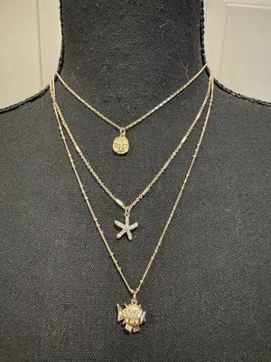 Collar en capas Lilly Pulitzer dorado estrella de mar soplado encanto 3 cadenas NUEVO Foto 1 de 4