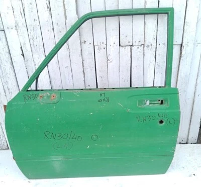 Toyota Hilux RN30 RN35 RN55 modelo 1979 88 puerta delantera izquierda lado usado Foto 1 de 4