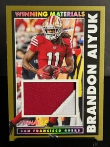2024 Panini Encore Red Winning Materials Brandon Aiyuk 49ers Gold 1/10 - Bild 1 von 3