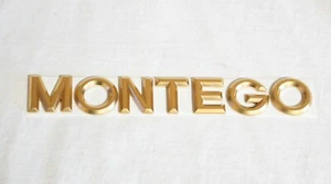 2004-2007 MERCURY "MONTEGO" 24K GOLD PLATED SATIN BRUSHED FINISH REAR EMBLEM - Bild 1 von 2