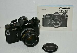 APPAREIL PHOTO CANON EF 35 mm (noir) avec objectif CANON FD 50 mm f 1,8 S C. Avec manuel. 