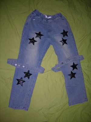 Jeans con estrellas de cuero negro 31 pulgadas cintura 27 largo talla M con detalles de cinturón para piernas Foto 1 de 3