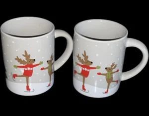 Crate and Barrel SKATING REINDEER Mug 4” by Joan Anderson 12oz Set Of 2 Pristine - Picture 1 of 4