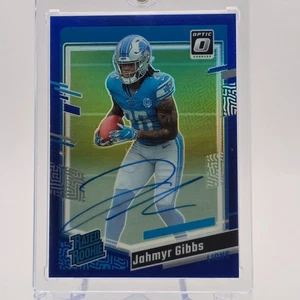 Donruss Optic Jahmyr Gibbs 2023 clasificación novato automático azul/99 - Imagen 1 de 2