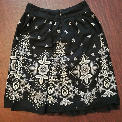 Falda de lentejuelas florales azul Justice para niñas talla 7 Foto 1 de 3