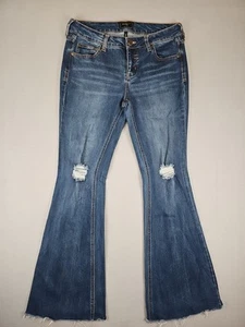 Pantalones de mezclilla Celebrity rosa acampanados desgastados tiro medio elásticos dobladillo crudo talla 30x31 BOHO - Imagen 1 de 8
