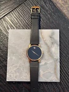 Movado Damenuhr mit schwarzem Zifferblatt und schwarzem Armband - Bild 1 von 2
