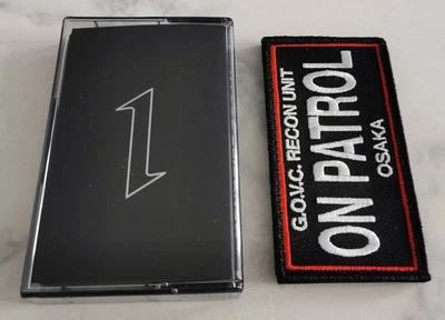 Genocide Organ - Obituary For Osaka Tape/MC + Patch TESCO POWER ELECTRONICS - Bild 1 von 3