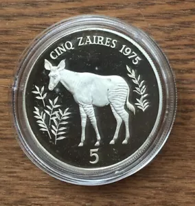 CC18 ZAIRE 1975 5 ZAIRE ARGENTO PROOF CONSERVAZIONE - CONIO 6431 - CERVO OKAPI - Foto 1 di 2