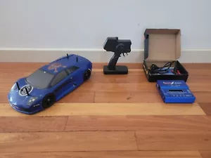 TAMIYA TA05 1/10 SCALE 4X4 BRUSHLESS HOBBYWING RTR KIT TOURING CAR + EXTRAS - Picture 1 of 22