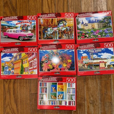 *NEW* LOT OF 7 PUZZLE BUG PUZZLES 500 PC. - Image 1 of 4