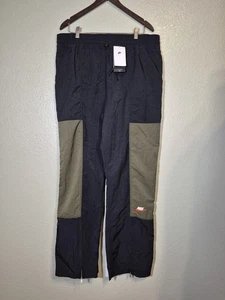 Neu mit Etikett Nike Damen XL City Utility gewebte hoch geschnittene Hose wasserabweisend schwarz/grün - Bild 1 von 8