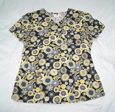 Blusa exfoliante mujer cruz blanca pequeña amarillo y negro estampado floral lazo espalda Foto 1 de 4