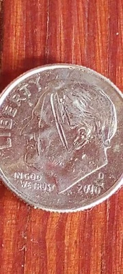 i have a error coin a dime the date say 2090 and the in God we trust is wack. - Image 1 of 4