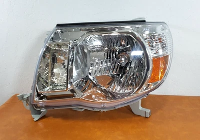 FIT 2005-2011 TOYOTA TACOMA LEFT DRIVER HALOGEN HEADLIGHT AFTER MARKET USED#2 - Image 1 of 4