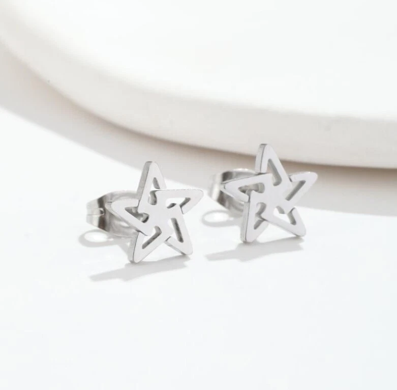 Aretes estrella titanio plata/oro/negro Foto 1 de 1