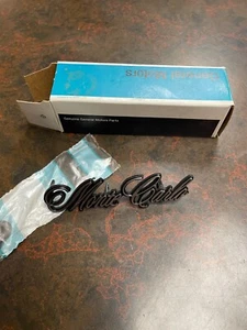 **NOS 1973 1974 1975 CHEVROLET MONTE CARLO HEADER PANEL EMBLEM 6258144 GM** - Picture 1 of 1