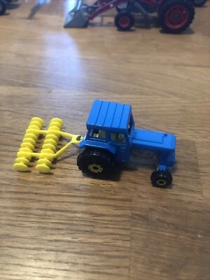 “SALE” MATCHBOX SUPER FAST FORD TRACTOR WITH HARROW YELLOW WHEELS - Image 1 of 4
