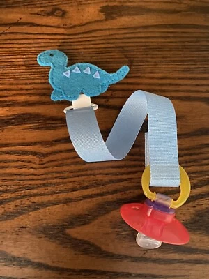 Cute Blue Dinosaur Ribbon Pacifier holder clip strap, binky, paci leash-Handmade - Image 1 of 2