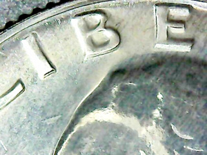 Doubling in 1969 washington quarter with error moneda 25 centavos con error