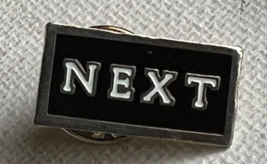 RARE NEXT (RETAILER) EMPLOYEE BLACK ENAMEL PIN BADGE - Picture 1 of 3