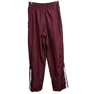 Pantaloni Nike Team Texas A&M Aggies Maroon Warm-Up Donna Piccolo Logo Pista Atleti - Foto 1 di 9