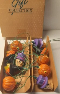 Avon Glowing Ghouls Luzes de Halloween Esqueleto de Abóbora Bruxa Caixa Original Pré-própria - Imagem 1 de 4