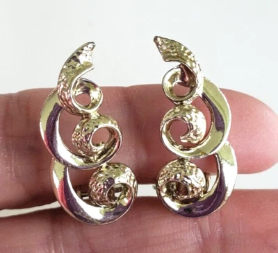 Vintage Signed Star Curly Cue Gold Tone Clip Earrings 1-1/8"w/ Cushion Pad - Image 1 of 4