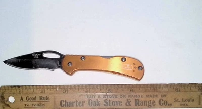 Cuchillo Buck USA 726 Mini Spitfire Lockback hoja única mango dorado Foto 1 de 4