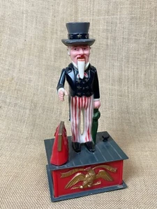 VTG1975 AMERICANA Uncle Sam Mechanical Bank 9" Plastic Box Coin Piggy Bank - Bild 1 von 6