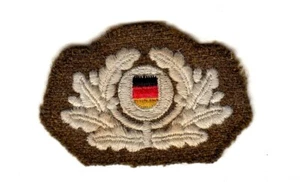  original Kokarde Mützenabzeichen Mützenkranz DDR KVP Käppi khaki 1954 - 58  - Picture 1 of 2