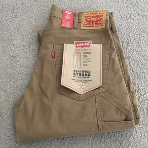 Levi's 565 Herren Größe 33 x 32 lose gerade Arbeitskleidung Utility khaki Stretch Hose - Bild 1 von 16