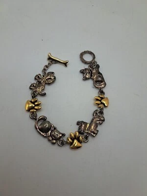 Pulsera con dije de pata de perro gato dorado tono plata palanca de metal diseño Premier PD Foto 1 de 4